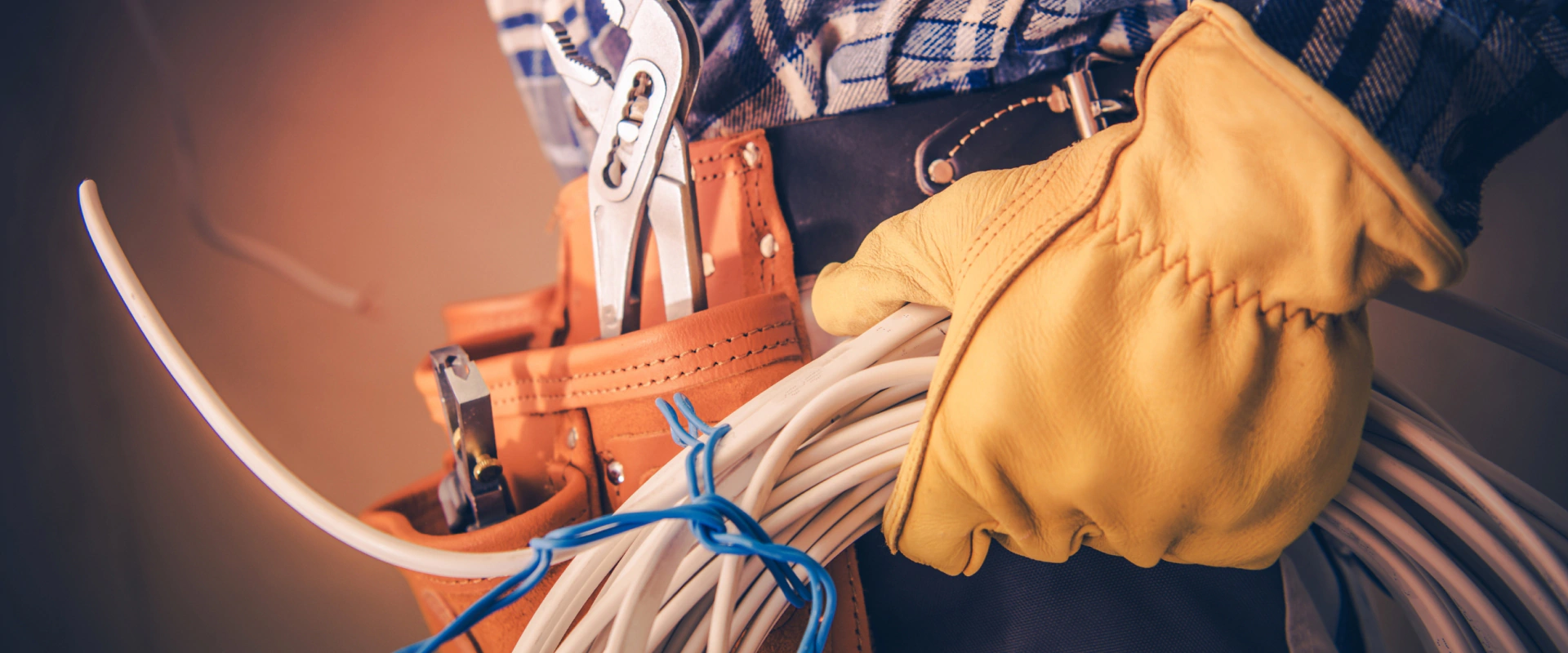 electrician with electrical cable